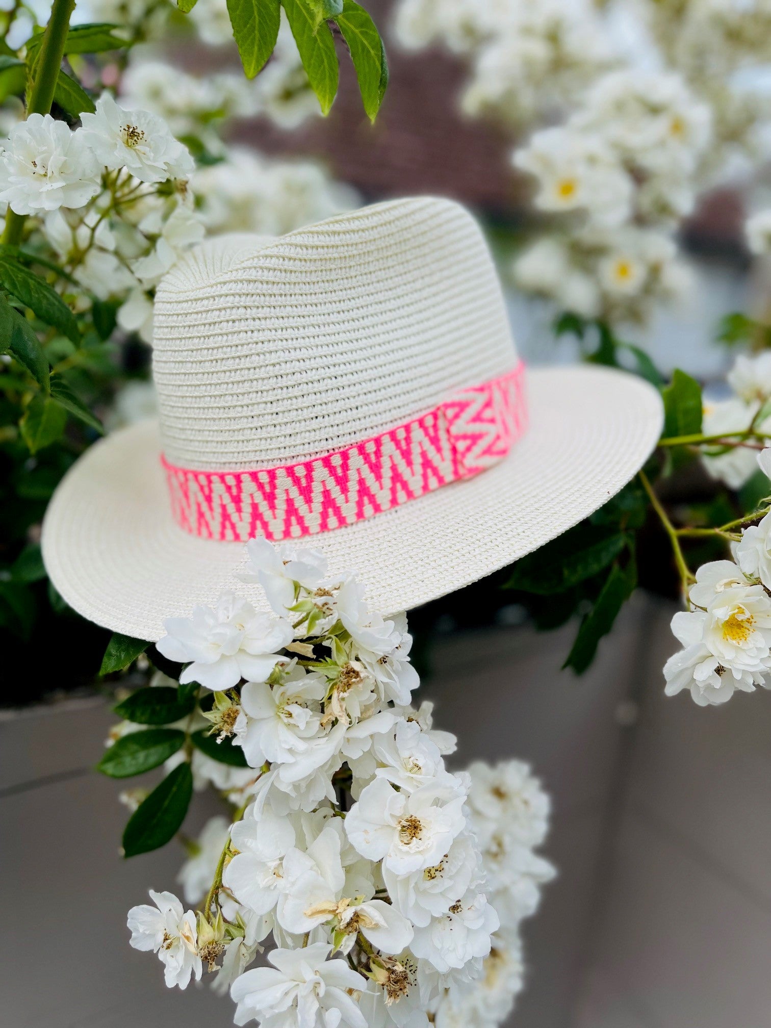 Summer straw fedora with neon pink band